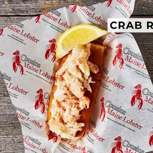 a lobster roll with a slice of lemon