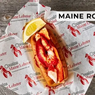 a lobster roll with a slice of lemon