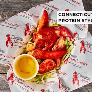 a plate of lobster with a side of mustard