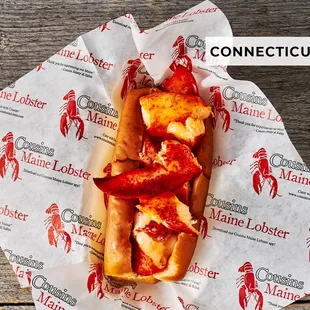 a lobster roll in a paper wrapper