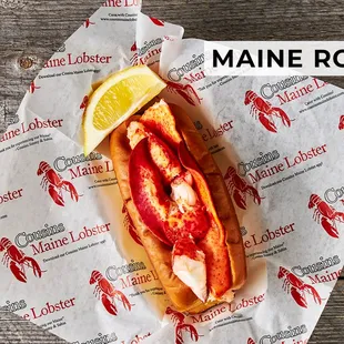 a lobster roll with a slice of lemon