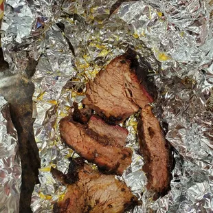 Picture doesn't do it justice. 1" thick × 2" chunks of fatty hard to chew brisket.