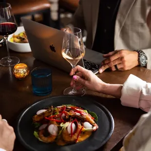 a man and a woman sharing a meal at a restaurant