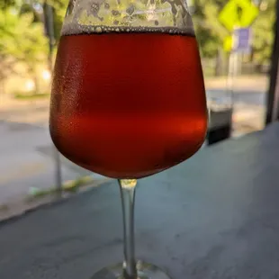a glass of beer on a table