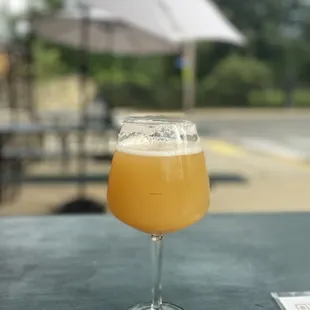 a glass of beer on a table