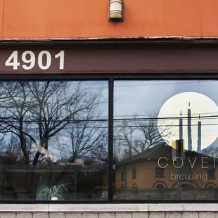 the reflection of the full moon in the window