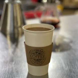 a cup of coffee on a table