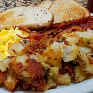 Early bird special M-F 3.89 from 7-9. From 9-11 its only 4.89! Two eggs, home-fries, bacon or sausage, toast &amp; jelly