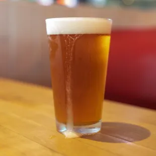 a glass of beer on a table