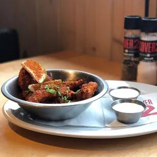 a bowl of fried chicken on a plate