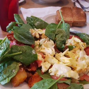 Spinach tomato egg potato breakfast bowl