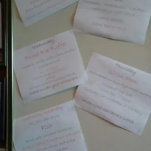 a fridge with a bunch of notes attached to it