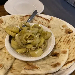 Hot peppers in oil with seasoned pita