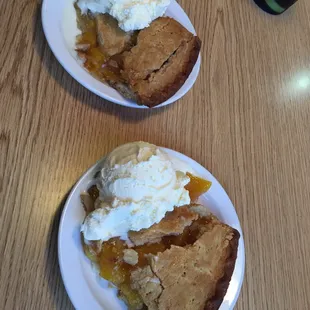 two plates of dessert with ice cream