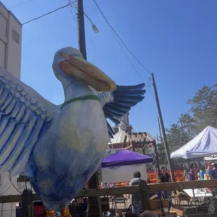 Pelican that welcomes you to his roost in the Covington Beer Garden