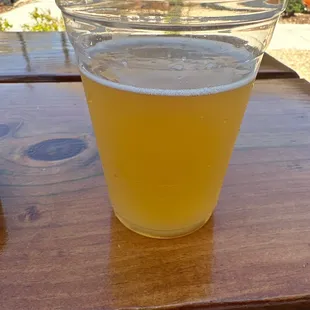 a glass of beer on a table