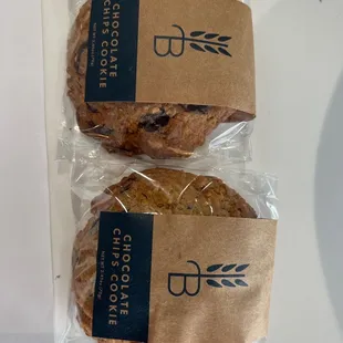 two cookies wrapped in brown paper