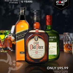 a bottle of old pur and two glasses of whiskey