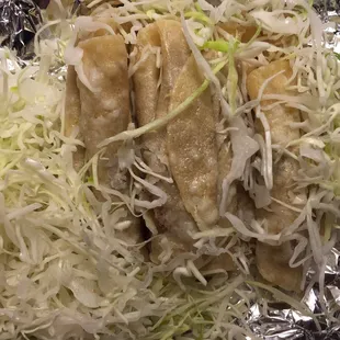 Tacos under the cabbage.
