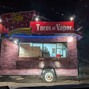 a cow taco at night