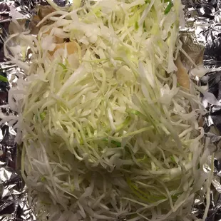 a close up of a cow taco