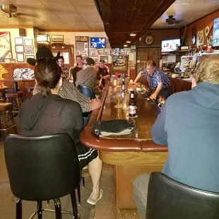 The bar with the owner slinging drinks