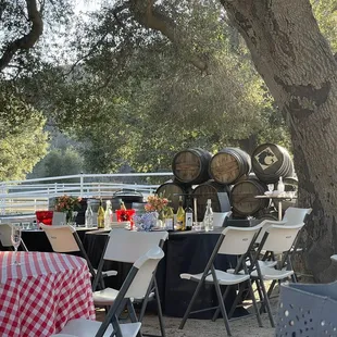 a table set up with wine barrels