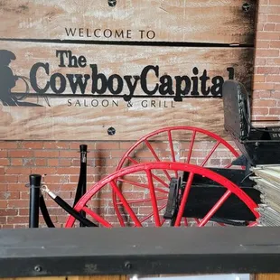 a bar with red chairs