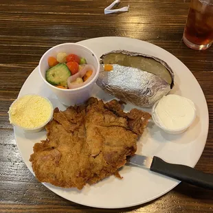 Chicken Fried Steak, baked potato and mixed veggies.