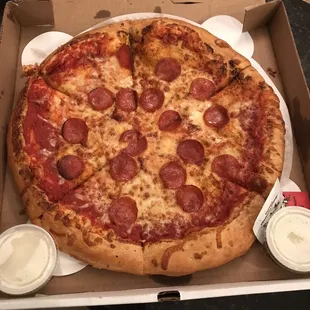 a pepperoni pizza in a box