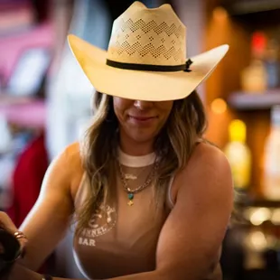a woman in a cowboy hat
