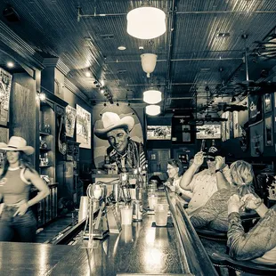 a group of people sitting at a bar