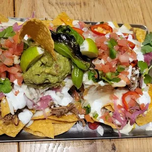 Brisket nachos. Enought for 4 people to share as appetizers.