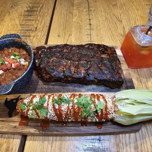 The Backyard Ribs with elote and baked beans