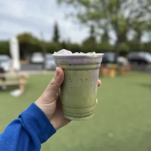 Matcha latte with blueberry cream top