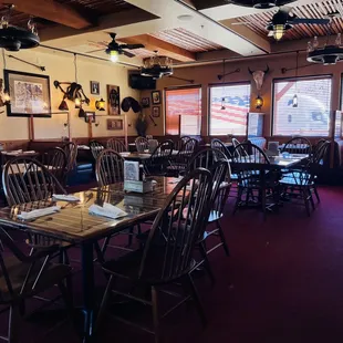  a dining room with tables and chairs