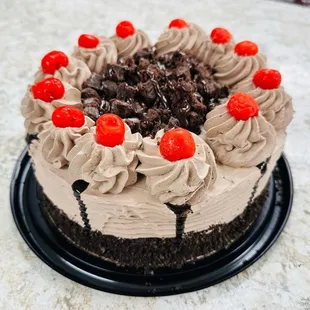  chocolate cake with a cherry on top