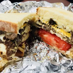 Found today's breakfast special. Ribeye steak, egg, and cheese breakfast sandwich with onion and tomato. Delicious!!