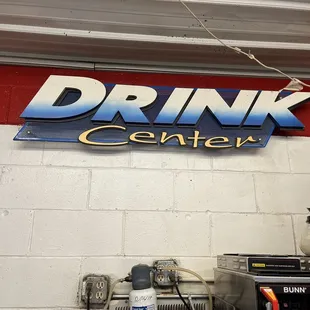 a sign that says drink center