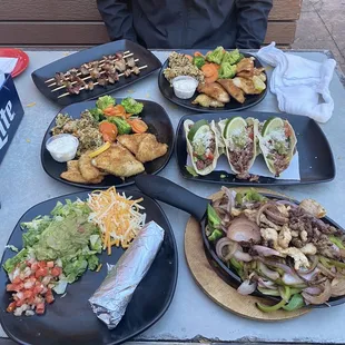Steak and shrimp fajitas, street tacos, pork belly skewers, 2 sunfish platters