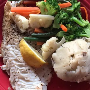Sautéed Walleye with seasonal vegetables and garlic mashed potatoes.