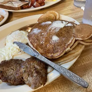 Mickey Mouse Pancakes with over medium eggs and country sausage