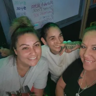 three women smiling for the camera