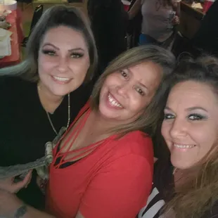 three women smiling for the camera