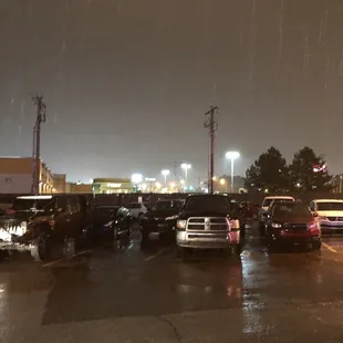 cars parked in a parking lot at night