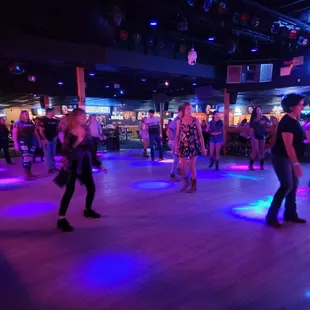 people dancing on a dance floor