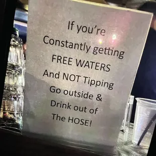a sign saying if you're constantly getting free water and not tipping go outside and drink out of the hose