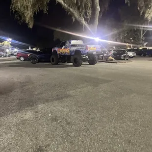 trucks parked in a parking lot at night