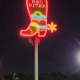 a cowboy boot on a pole