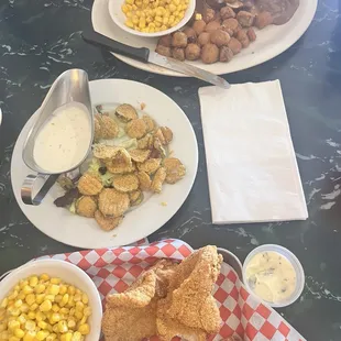 Chuck steak with onion and mushroom gravy as well as a catfish platter and fried pickles appetizer.